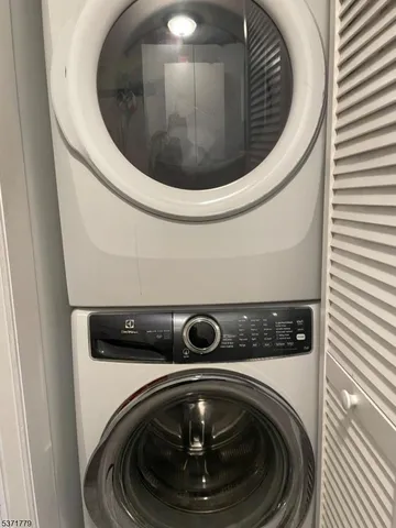 a bathroom with a granite countertop toilet a sink and bathtub