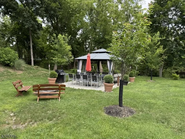 a view of a backyard with sitting area