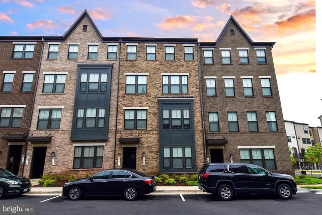 a car parked in front of a brick building
