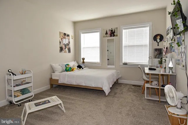 a bedroom with a bed and a cabinets