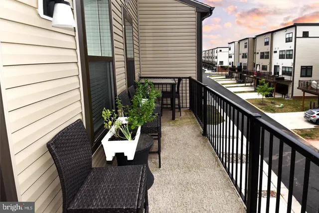 a view of a balcony with furniture