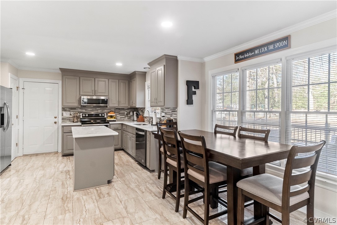 13020 Carters Way Road Chesterfield, VA 23838 - Photo 14 of 49 a kitchen with kitchen island granite countertop wooden floors and white appliances