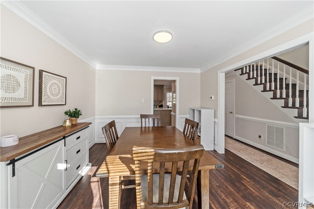 13020 Carters Way Road Chesterfield, VA 23838 - Photo 19 of 49 a kitchen with stainless steel appliances granite countertop a stove a sink a dining table and chairs with wooden floor