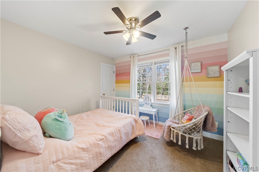 13020 Carters Way Road Chesterfield, VA 23838 - Photo 28 of 49 a bedroom with a bed and a chandelier