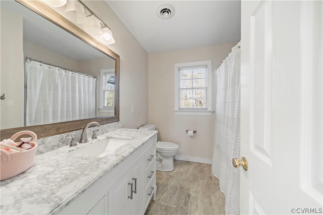 13020 Carters Way Road Chesterfield, VA 23838 - Photo 29 of 49 a bathroom with a granite countertop sink a toilet and a mirror
