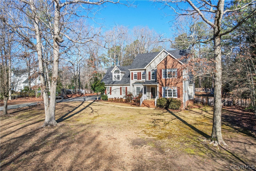 13020 Carters Way Road Chesterfield, VA 23838 - Photo 37 of 49 a view of a town with brick walls plants and large trees