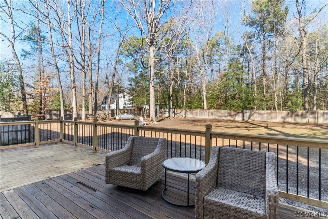 13020 Carters Way Road Chesterfield, VA 23838 - Photo 48 of 49 a view of a roof deck with couches and wooden fence