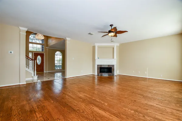 an open kitchen with white cabinets and stainless steel appliances