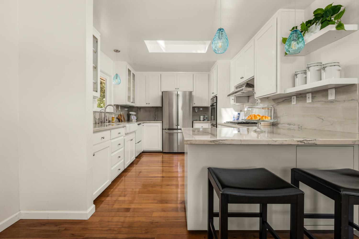 10875 Spenceville Road Penn Valley, CA 95946 - Photo 11 of 49 a kitchen with stainless steel appliances a table and chairs in it