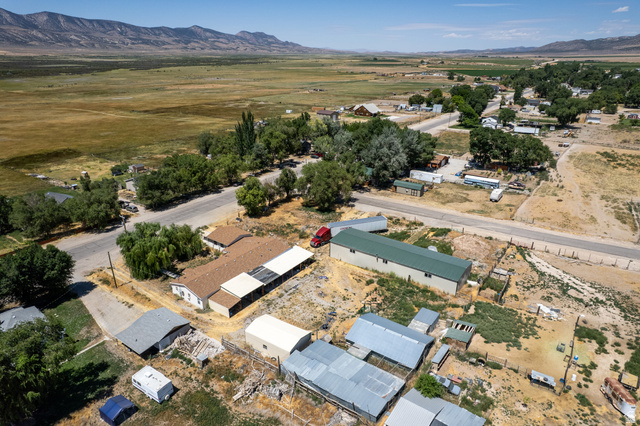 445 South Main Street Fayette, UT 84630 - Photo 7 of 45 Aerial view of property's location featuring a mountainous background and nearby suburban area
