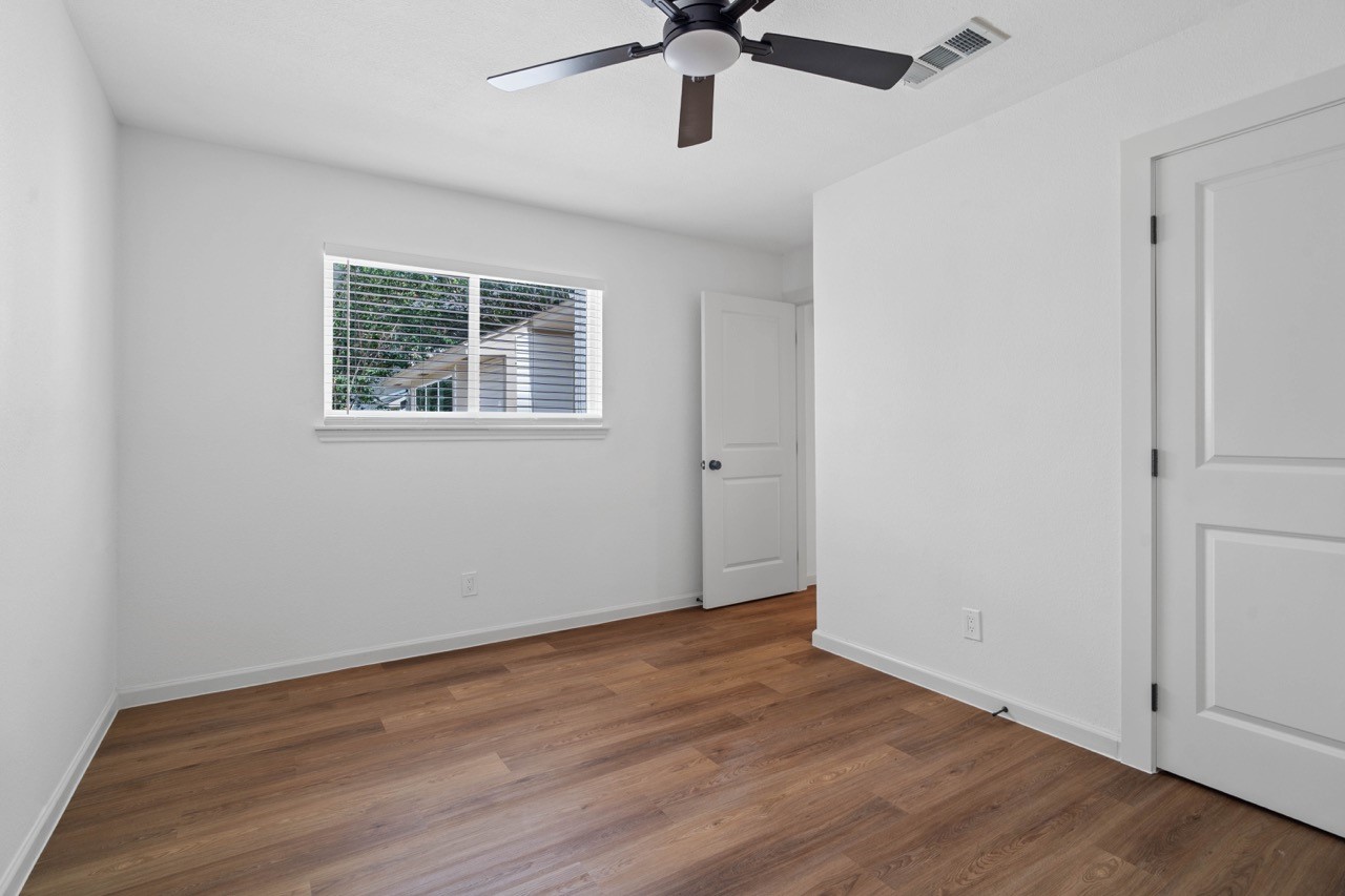 5326 Findlay Drive Pasadena, TX 77505 - Photo 45 of 50 Natural light fills this secondary bedroom, complete with luxury vinyl plank flooring and modern finishes.