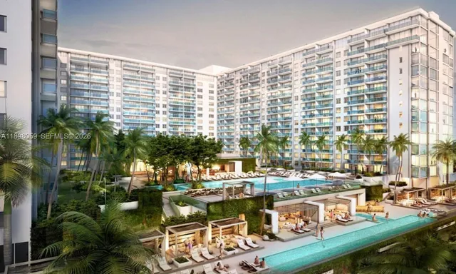 a view of swimming pool with outdoor seating and plants