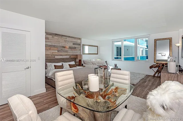 a living room with fireplace furniture and a table