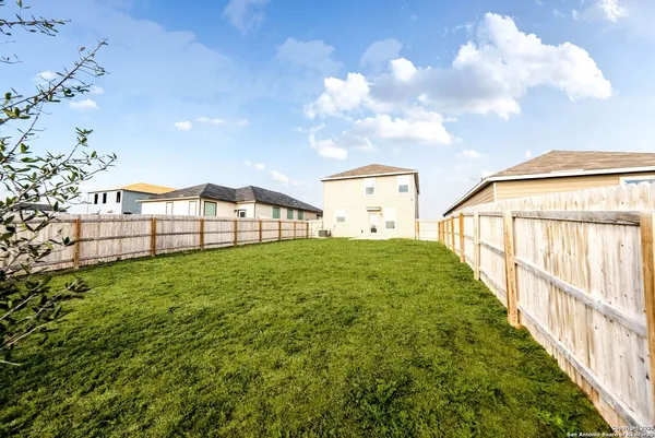 a view of a swimming pool with a lounge chair