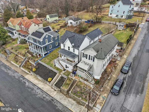 an aerial view of a house with a ocean view