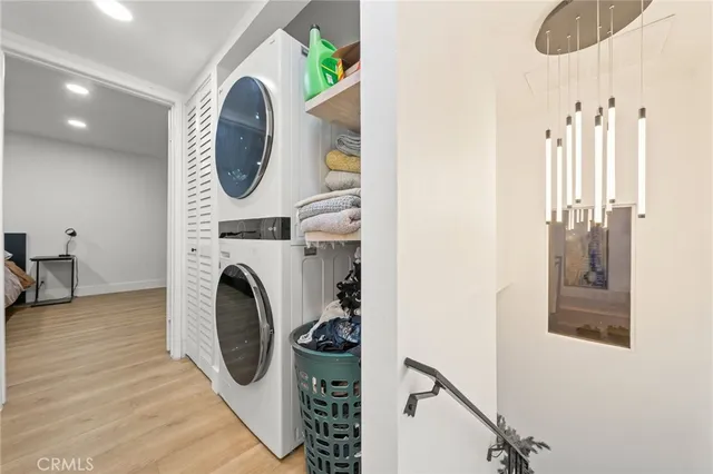 a view of a hallway with washer and dryer