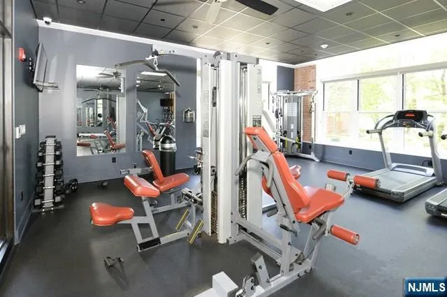 a view of game room with furniture and window