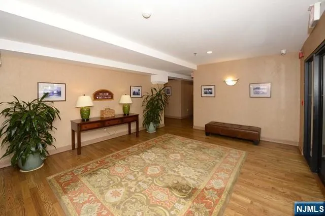 a view of a room with wooden floor and outdoor seating