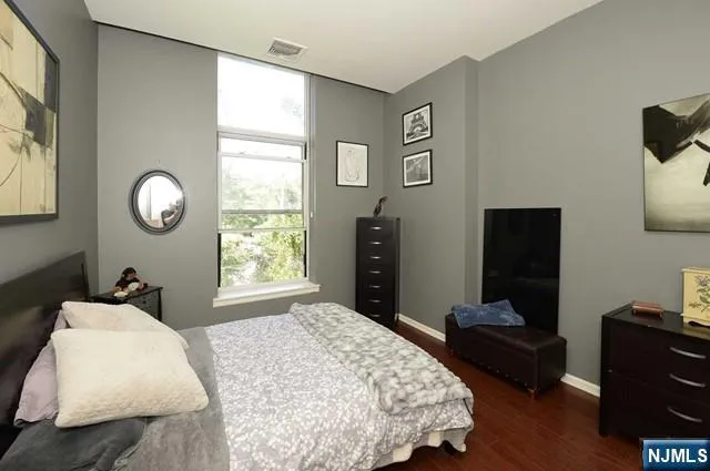 a bedroom with bed and window