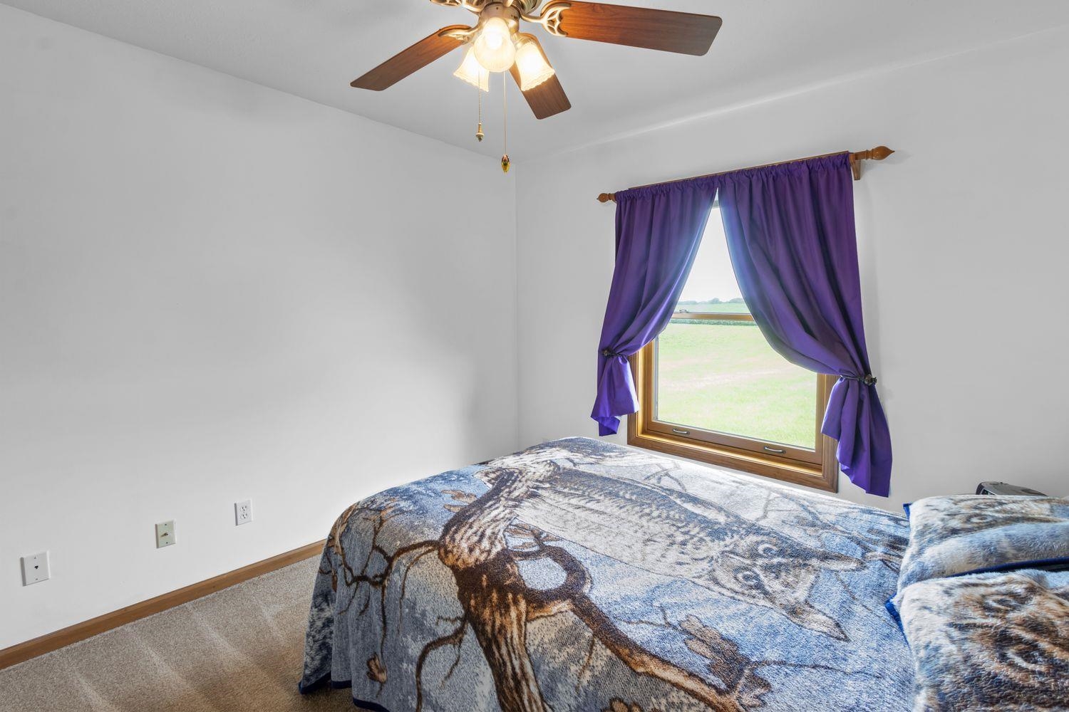 6771 Friday Road Byron, IL 61010 - Photo 16 of 25 a bedroom with a bed and a window