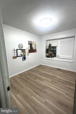 a view of a livingroom with wooden floor