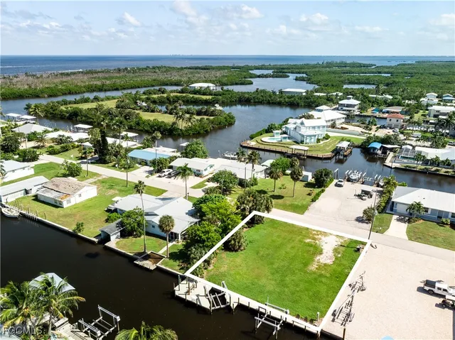an aerial view of a city with lawn chairs