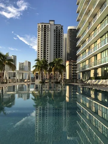 a view of swimming pool from a balcony