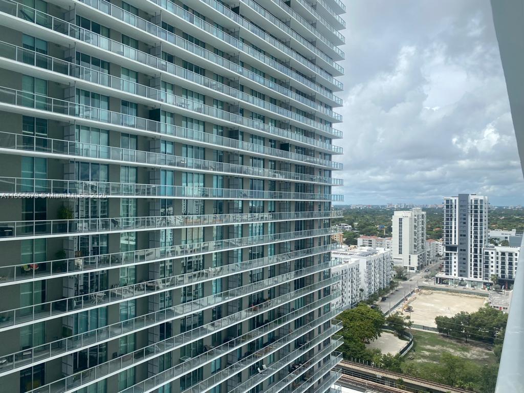 1111 Southwest 1st Avenue, Unit 2217N Miami, FL 33130 - Photo 10 of 14 a view of a balcony with a barbeque