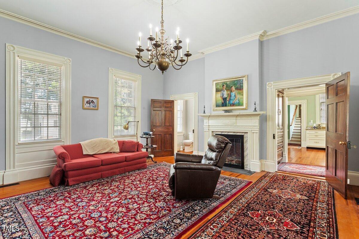 206 Shaver Road Macon, NC 27551 - Photo 23 of 68 a living room with furniture and a fireplace