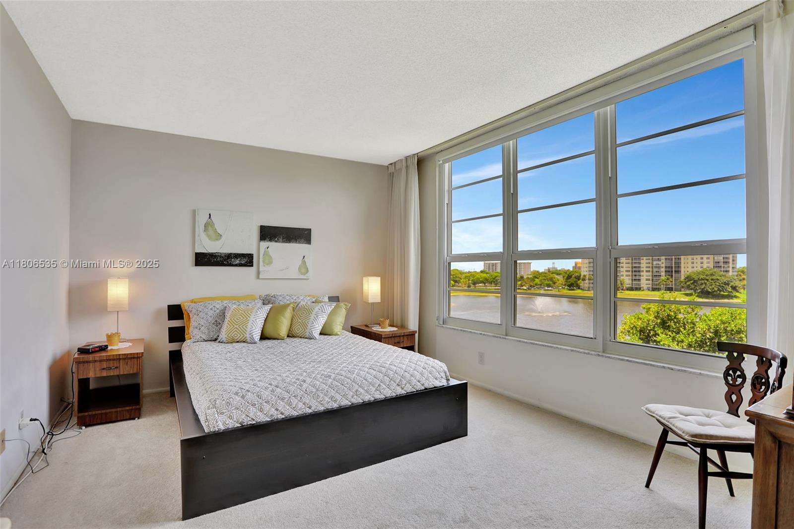 3091 North Course Drive, Unit 502 Pompano Beach, FL 33069 - Photo 14 of 42 a living room with furniture and a large window
