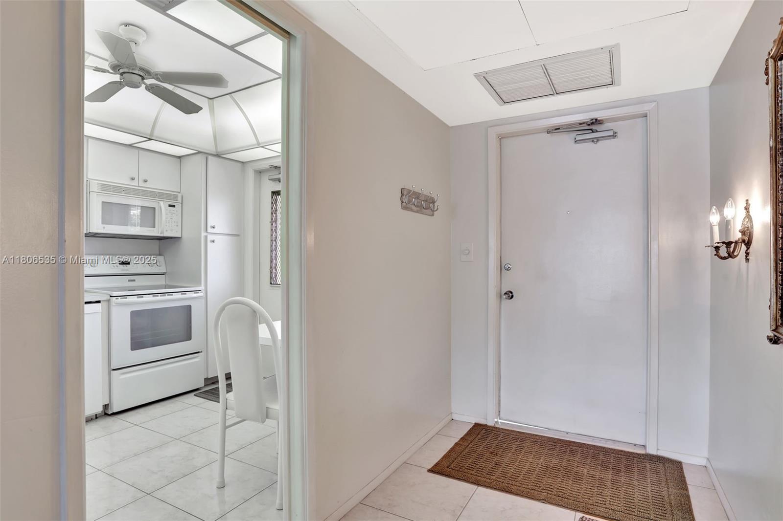 3091 North Course Drive, Unit 502 Pompano Beach, FL 33069 - Photo 2 of 42 a view of kitchen with sink and refrigerator