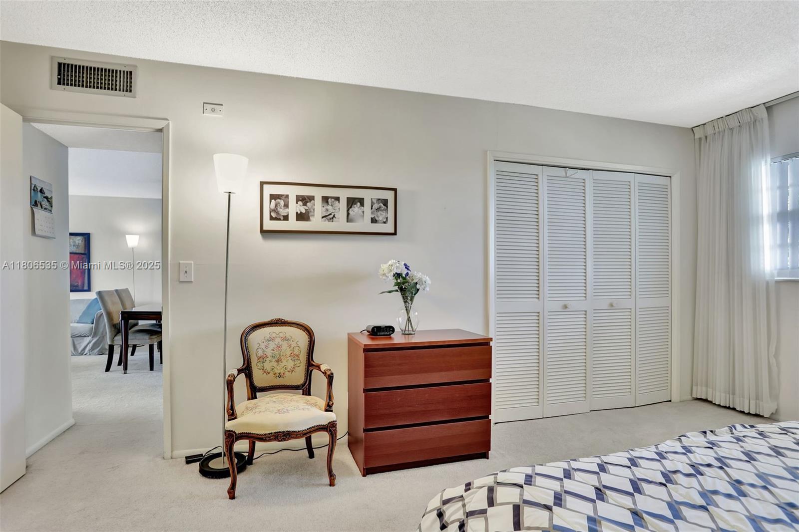3091 North Course Drive, Unit 502 Pompano Beach, FL 33069 - Photo 23 of 42 a view of a bedroom with workspace