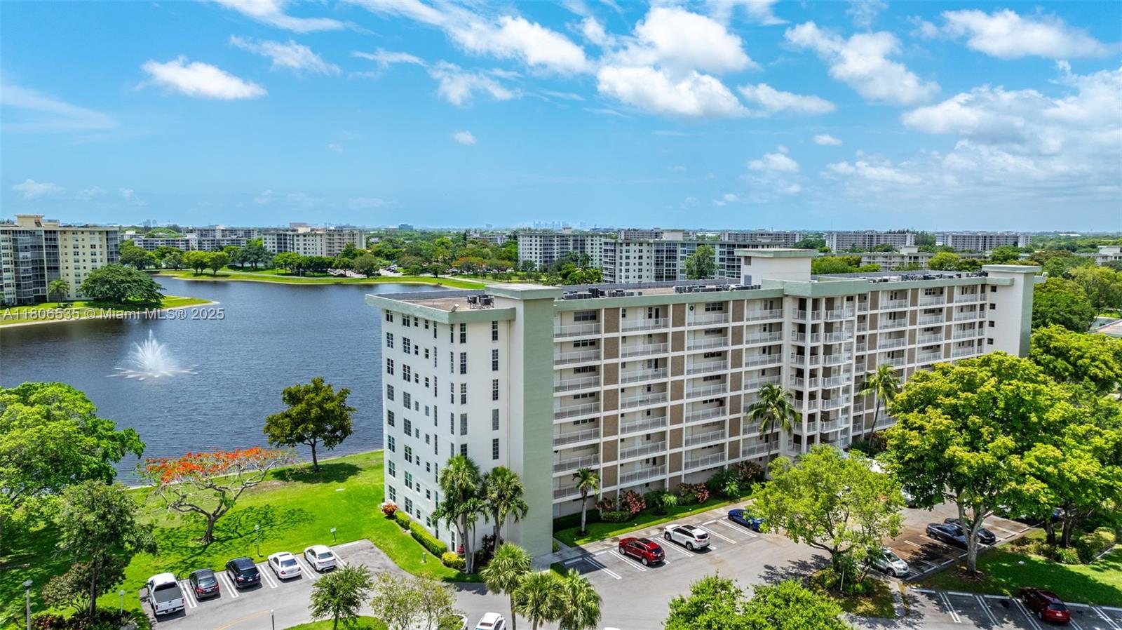 3091 North Course Drive, Unit 502 Pompano Beach, FL 33069 - Photo 32 of 42 a view of a lake with a building in the background