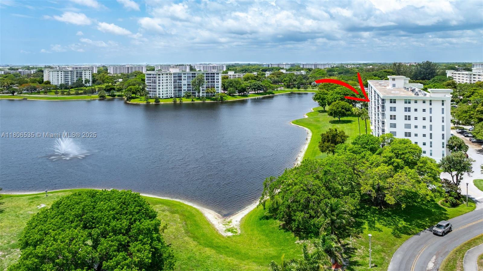 3091 North Course Drive, Unit 502 Pompano Beach, FL 33069 - Photo 37 of 42 a view of a lake with a building in the background