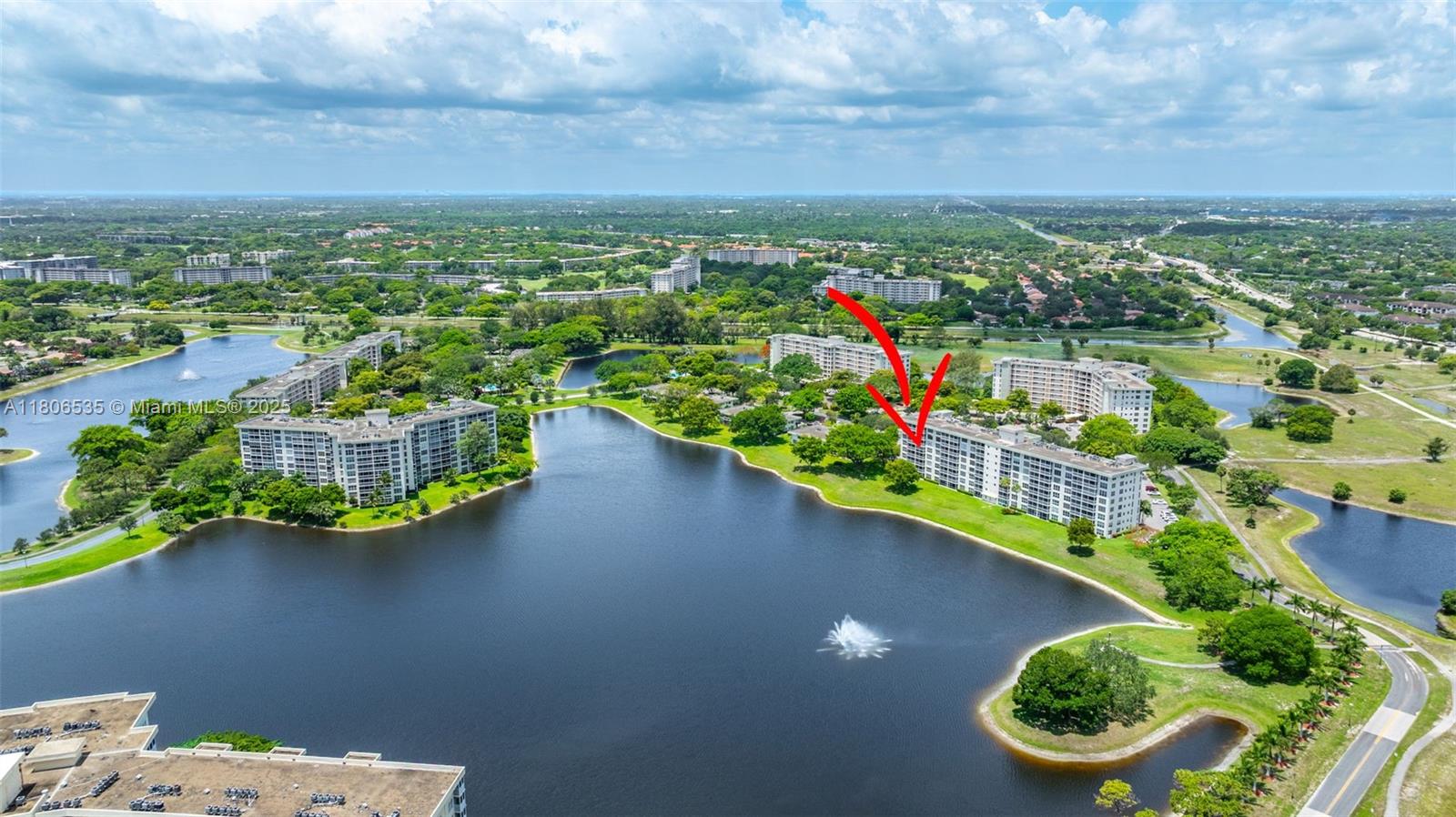 3091 North Course Drive, Unit 502 Pompano Beach, FL 33069 - Photo 39 of 42 an aerial view of a house with a garden and lake view