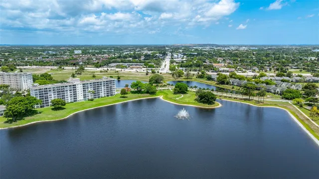 front view of a building with a garden