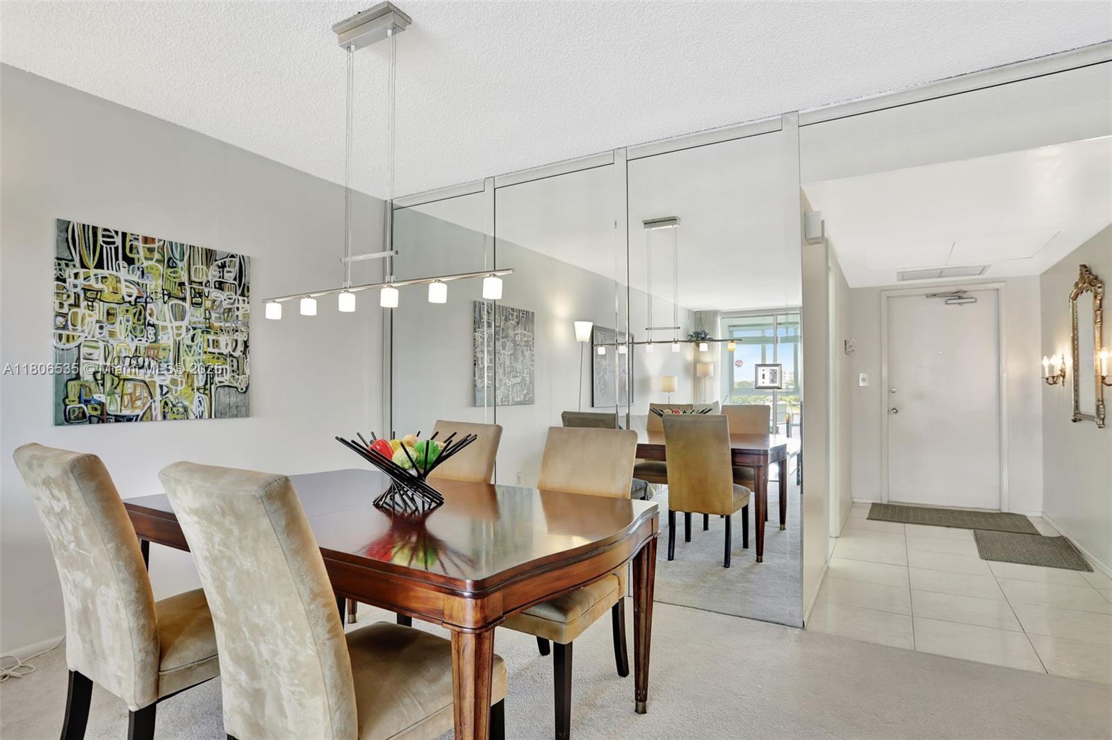 3091 North Course Drive, Unit 502 Pompano Beach, FL 33069 - Photo 9 of 42 a view of a dining room with furniture