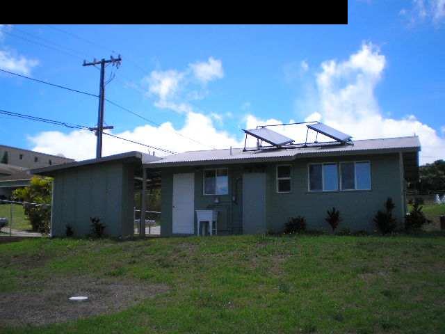 33 Maha Road, Unit 4 Makawao, HI 96768 - Photo 2 of 4 a view of a house with backyard and sitting area