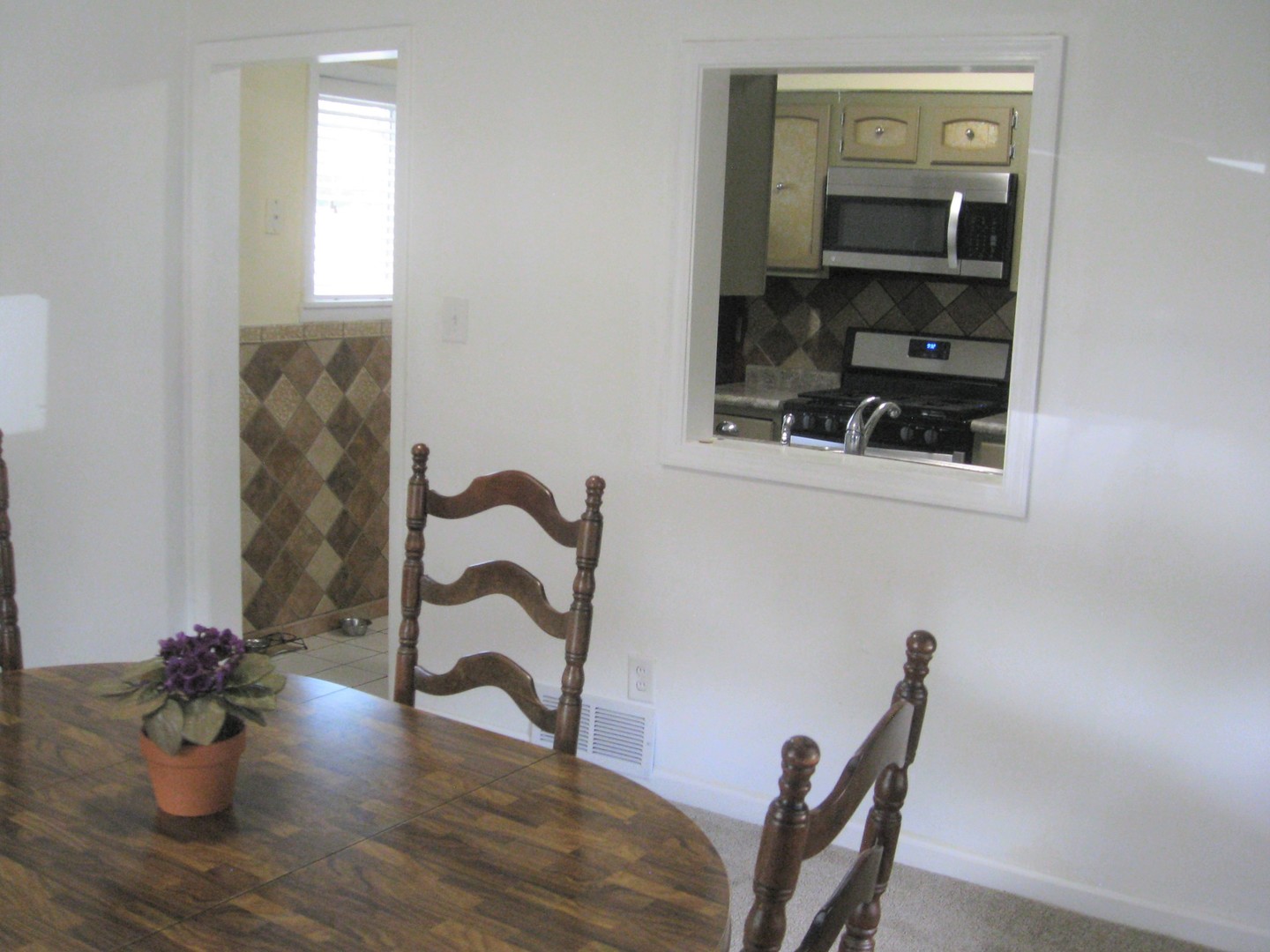 526 Spruce Road Bolingbrook, IL 60440 - Photo 4 of 13 a view of workspace with wooden floor and mirror