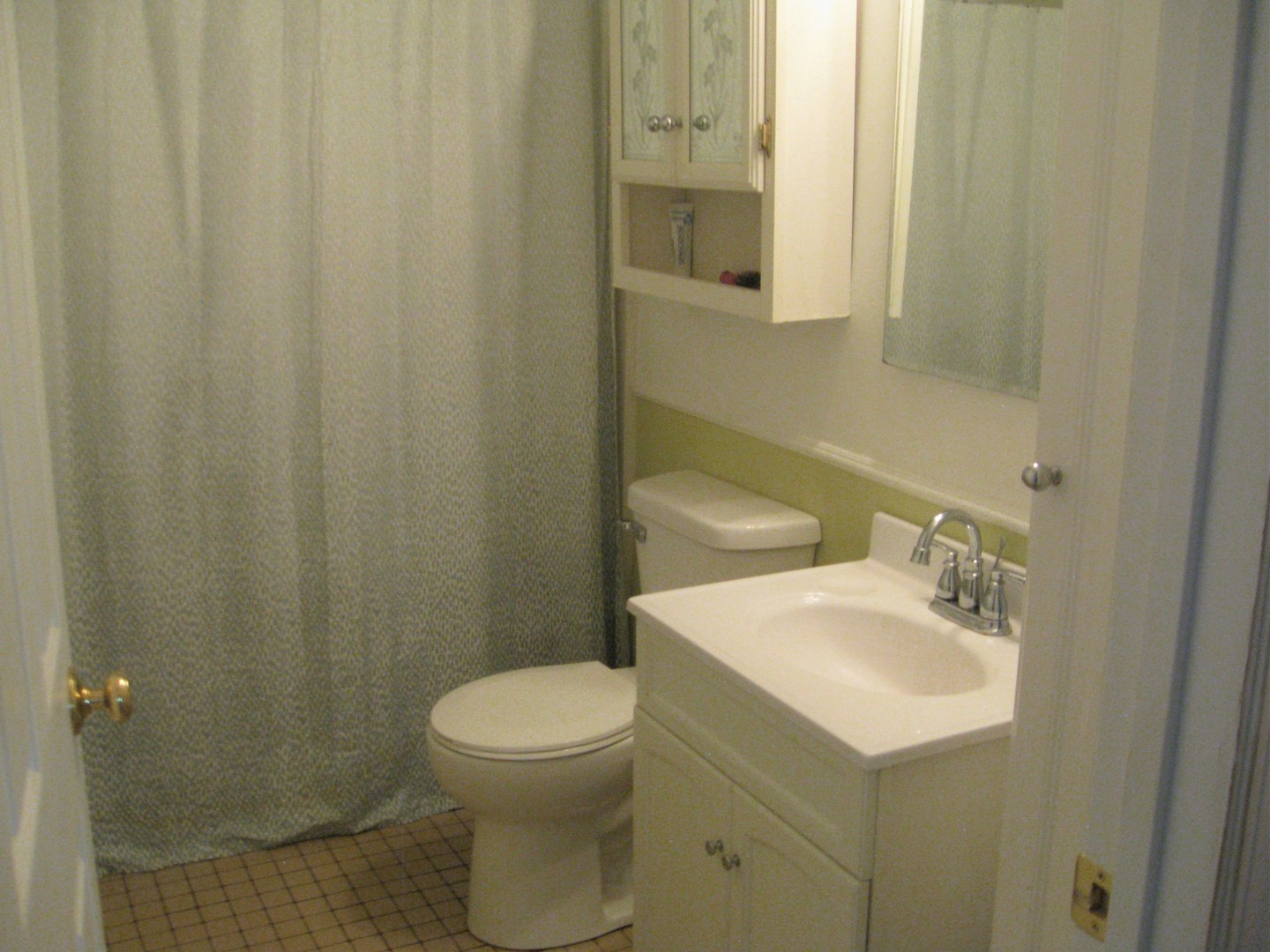 526 Spruce Road Bolingbrook, IL 60440 - Photo 7 of 13 a bathroom with a sink a toilet and shower