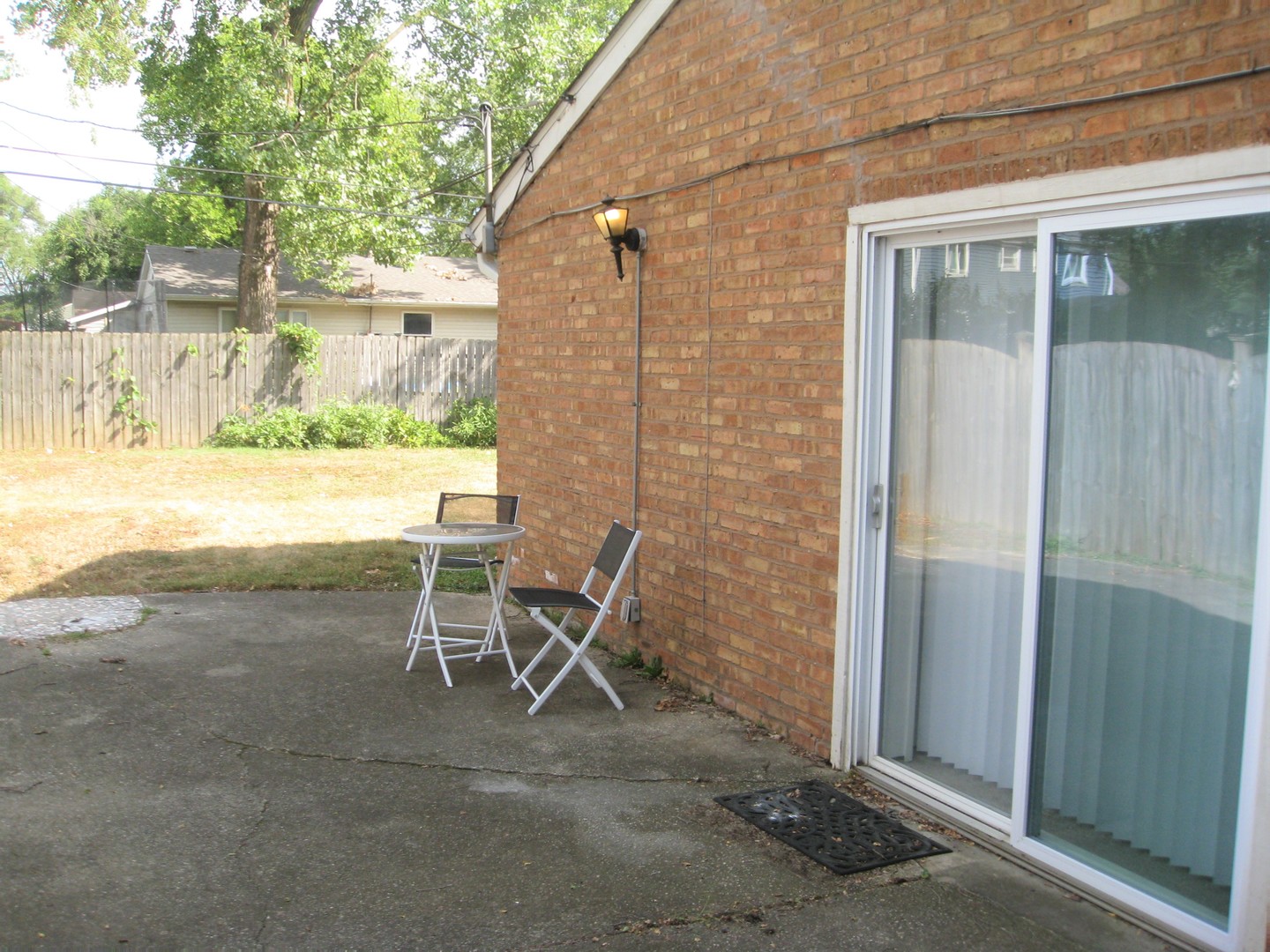 526 Spruce Road Bolingbrook, IL 60440 - Photo 10 of 13 a view of chair and table in the patio