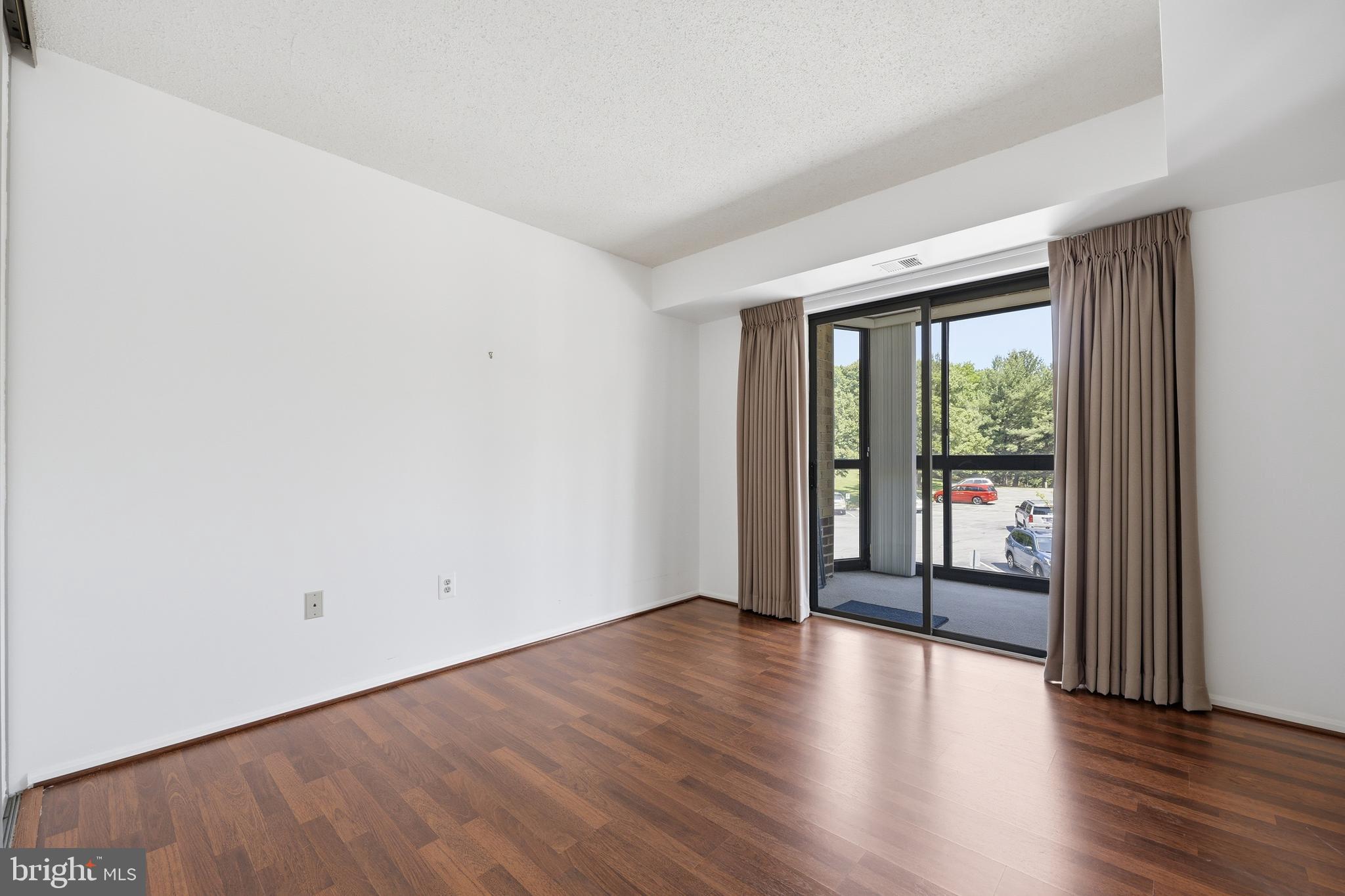 3330 North Leisure World Boulevard, Unit 5109 Silver Spring, MD 20906 - Photo 19 of 44 2nd Bedroom: Sliding Doors to Balcony