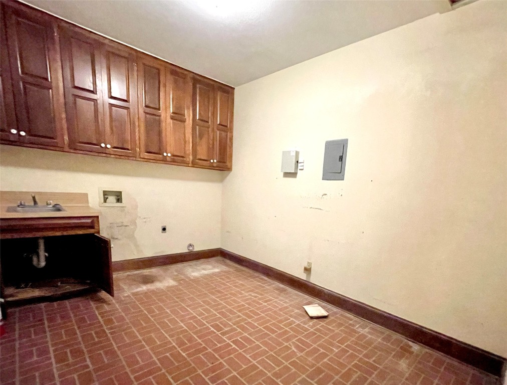 2 Sentinel Hill Austin, TX 78737 - Photo 12 of 40 a view of a kitchen with granite countertop cabinets and a wooden floor