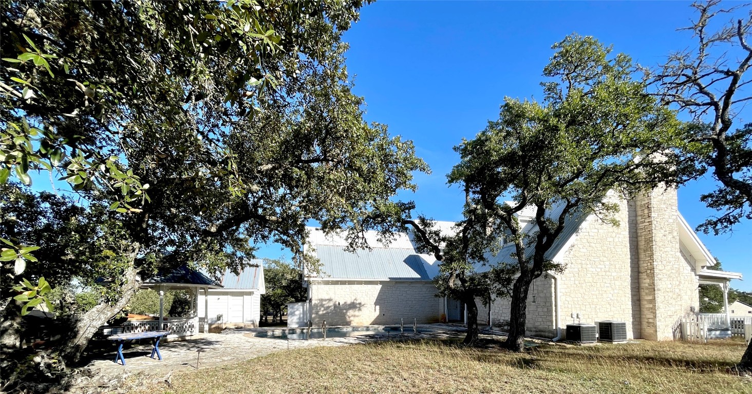 2 Sentinel Hill Austin, TX 78737 - Photo 18 of 40 a tree in the middle of a yard
