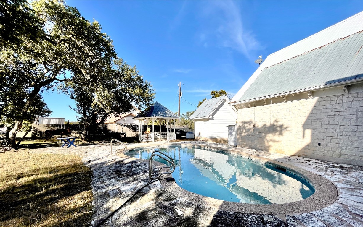 2 Sentinel Hill Austin, TX 78737 - Photo 19 of 40 a view of a house with a yard