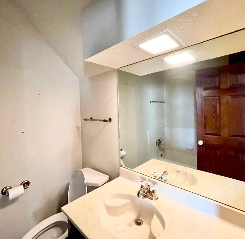 2 Sentinel Hill Austin, TX 78737 - Photo 23 of 40 a bathroom with a sink and mirror