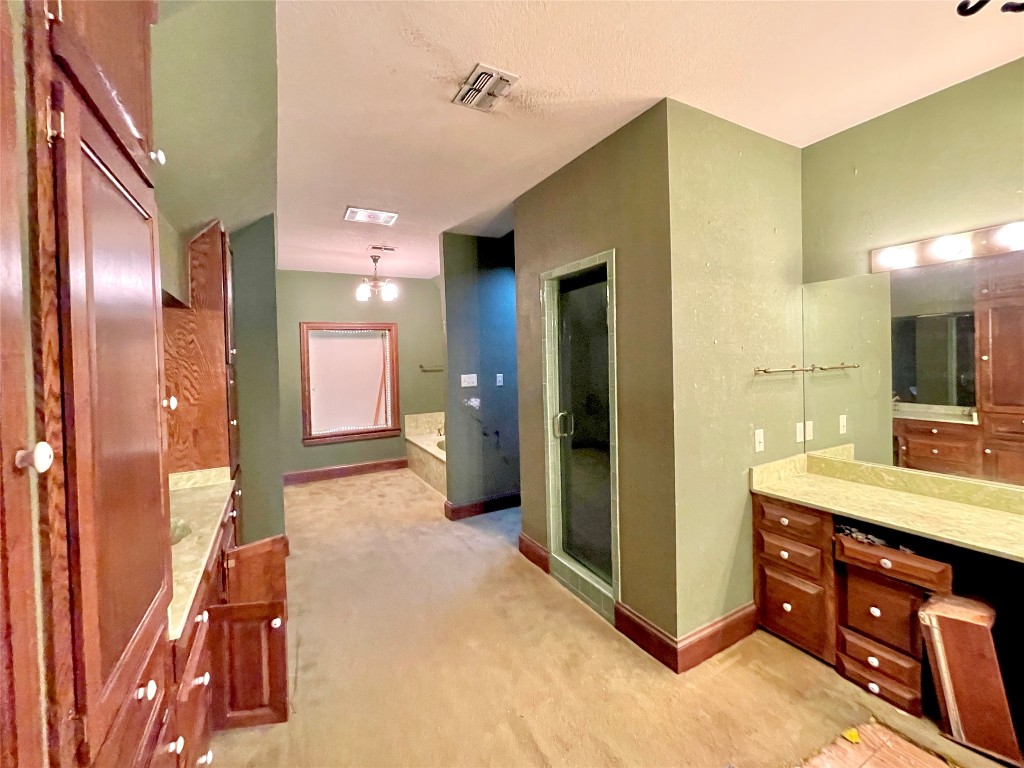2 Sentinel Hill Austin, TX 78737 - Photo 26 of 40 a bathroom with a sink and a mirror