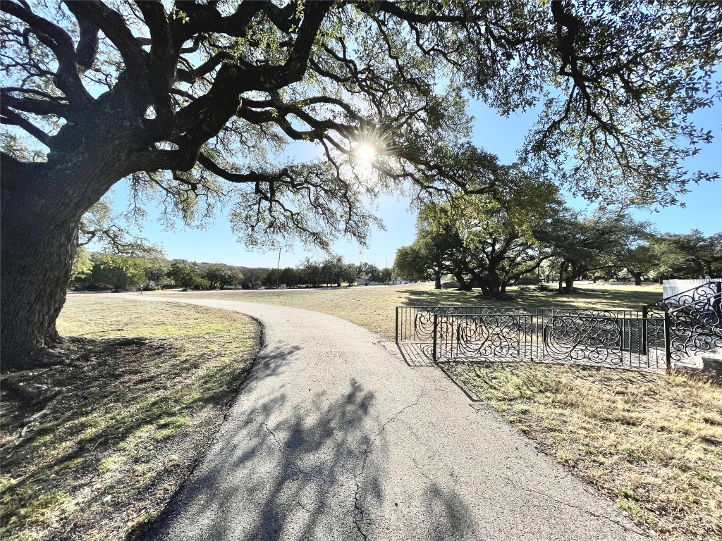 2 Sentinel Hill Austin, TX 78737 - Photo 39 of 40 a view of a water pond with outdoor seating