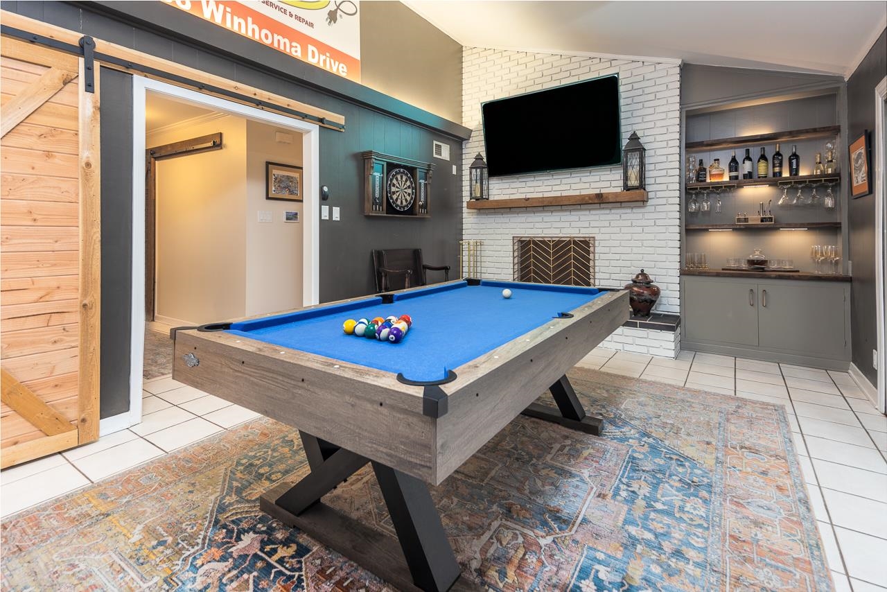 5641 Normandy Road Memphis, TN 38120 - Photo 13 of 25 a room with pool table flat screen tv and windows