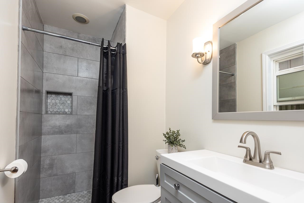 5641 Normandy Road Memphis, TN 38120 - Photo 16 of 25 a bathroom with a sink toilet and shower